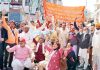 Dharmarth Trust employees raising slogans during protest at Jammu on Wednesday.