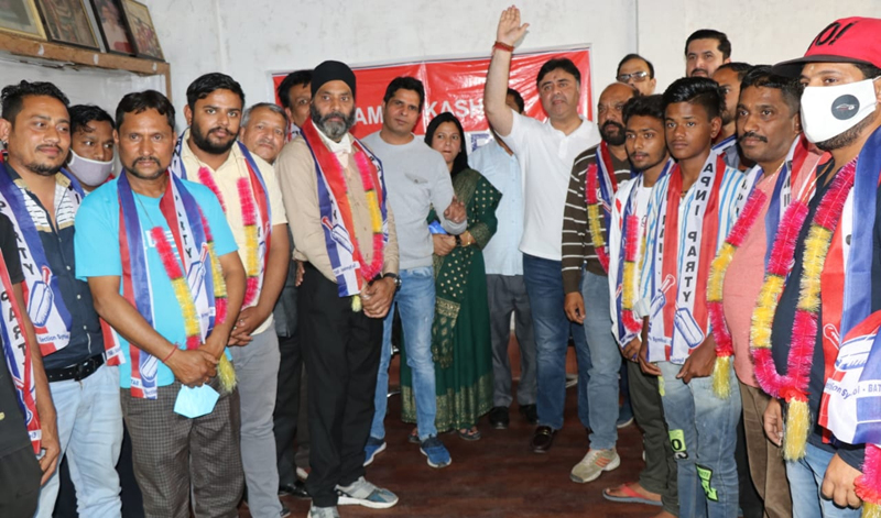 Apni Party general secretary Vikram Malhotra posing with new entrants of the party in Jammu. Apni Party general secretary Vikram Malhotra posing with new entrants of the party in Jammu.