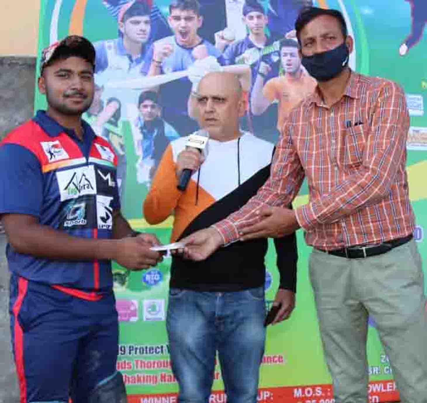 Former Ranji player Rajesh Gill presenting man of the match award to a player at Jammu on Monday. Former Ranji player Rajesh Gill presenting man of the match award to a player at Jammu on Monday.