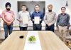 Principal Govt Polytechnic Jammu and Director MIET Jammu displaying copies of MoU.
