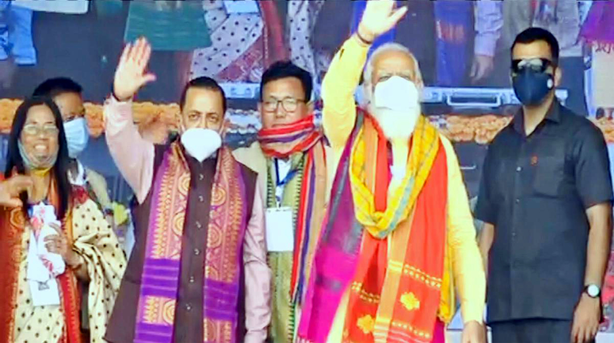 Prime Minister Narendra Modi waving at a mammoth public rally at Tamulpur. Also seen is Union Minister Dr Jitendra Singh. Prime Minister Narendra Modi waving at a mammoth public rally at Tamulpur. Also seen is Union Minister Dr Jitendra Singh.