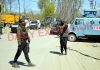 Security forces near the site of encounter at Pulwama on Friday. — Excelsior/Younis Khaliq