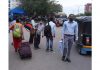 Passengers carrying baggages moving towards Jammu Railway Station on foot as transporters remain on strike. — Excelsior/Rakesh