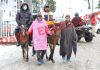 Tourists enjoy snowfall in Gulmarg on Saturday. —Excelsior/Aabid Nabi