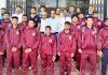 Wrestling team posing for group photograph with Divisional Sports Officer Jammu, Ashok Singh and others at Jammu.