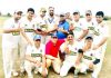 Winners posing for a group photograph after the match at Jammu on Monday.