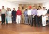 Returning Officer Vinod Sharma and IGP Jammu Mukesh Singh posing with newly elected team of Amar Singh Club. — Excelsior/Rakesh