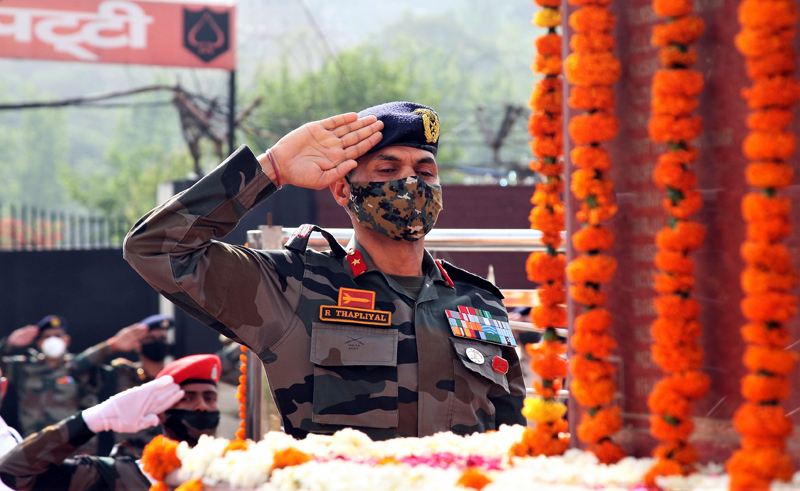 A senior Army officer paying tributes to martyrs to mark Rajouri Day. A senior Army officer paying tributes to martyrs to mark Rajouri Day.