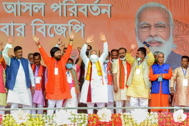 Prime Minister Narendra Modi during an election campaign rally in support of BJP party candidates for the West Bengal Assembly polls, at Rashmela Maidan in Cooch Behar district. Prime Minister Narendra Modi during an election campaign rally in support of BJP party candidates for the West Bengal Assembly polls, at Rashmela Maidan in Cooch Behar district.