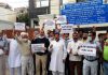 NPP activists staging protest outside NHAI office in Jammu on Tuesday.