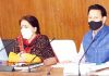 DDC chairperson and officers during a meeting.