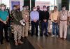 JPDA office bearers along with CISF personnel posing for a group photograph at Jammu Airport.