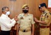 IGP Jammu Zone Mukesh Singh pinning new rank to police official.