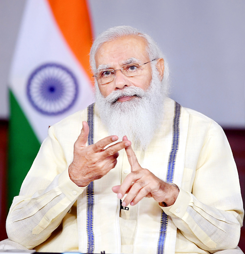 Prime Minister Narendra Modi interacting with the State and district officials across the country on COVID-19 management through video conferencing in New Delhi on Tuesday. (UNI) Prime Minister Narendra Modi interacting with the State and district officials across the country on COVID-19 management through video conferencing in New Delhi on Tuesday. (UNI)