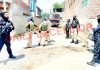 Security personnel at the site of encounter in Srinagar on Monday. -Excelsior/Shakeel