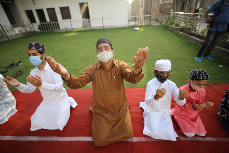 A few people offering Eid prayers at Eidgah Jammu on Thursday. — Excelsior/Rakesh A few people offering Eid prayers at Eidgah Jammu on Thursday. — Excelsior/Rakesh