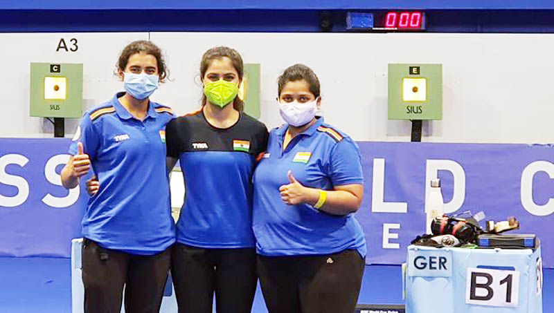Women’s shooting team posing for group photograph after clinching bronze medal. Women’s shooting team posing for group photograph after clinching bronze medal.
