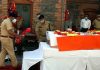 Senior police officers laying wreaths on the coffin of the two martyred cops who lost their lives in a militant attack at Sopore in North Kashmir. (UNI)