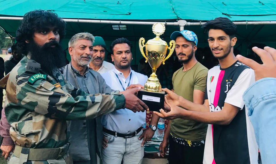 Winners being awarded with winning trophy at Magam in Handwara on Wednesday. Winners being awarded with winning trophy at Magam in Handwara on Wednesday.