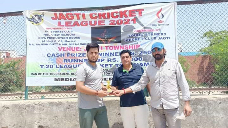 A player being awarded with man of the match trophy during Jagti Cricket League match on Monday. A player being awarded with man of the match trophy during Jagti Cricket League match on Monday.