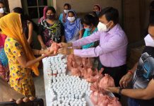 BJP general secretary Vibodh Gupta distributing immunity boosters in Jammu on Wednesday.