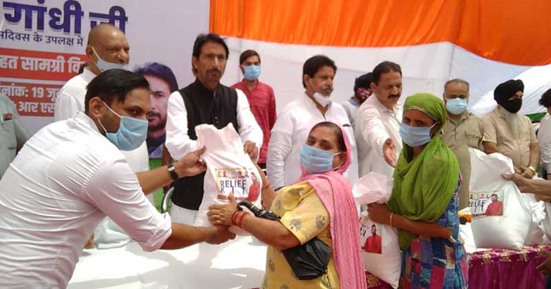 PCC chief G A Mir alongwith other Congress leaders distributing free ration among needy at RS Pura. PCC chief G A Mir alongwith other Congress leaders distributing free ration among needy at RS Pura.