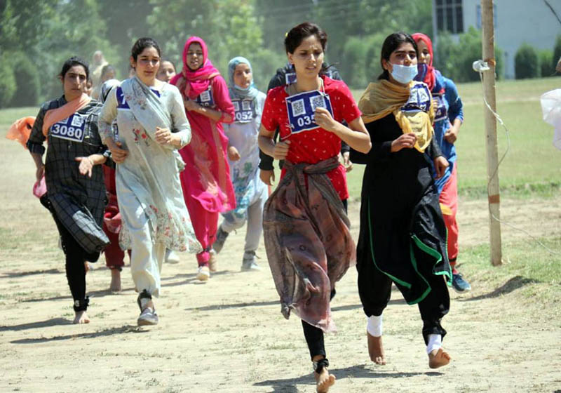 Candidates during the recruitment for the post of constables in women battalions for the Kashmir province in Srinagar on Tuesday. Candidates during the recruitment for the post of constables in women battalions for the Kashmir province in Srinagar on Tuesday.