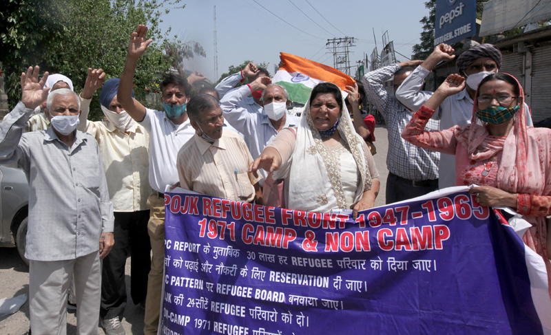 DPs from PoJK staging protest demonstration near Press Club in Jammu on Tuesday. -Excelsior/ Rakesh DPs from PoJK staging protest demonstration near Press Club in Jammu on Tuesday. -Excelsior/ Rakesh