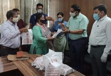 Mayor, Chander Mohan Gupta distributing Ayush medicines among Safai Karamcharis at Jammu on Wednesday.