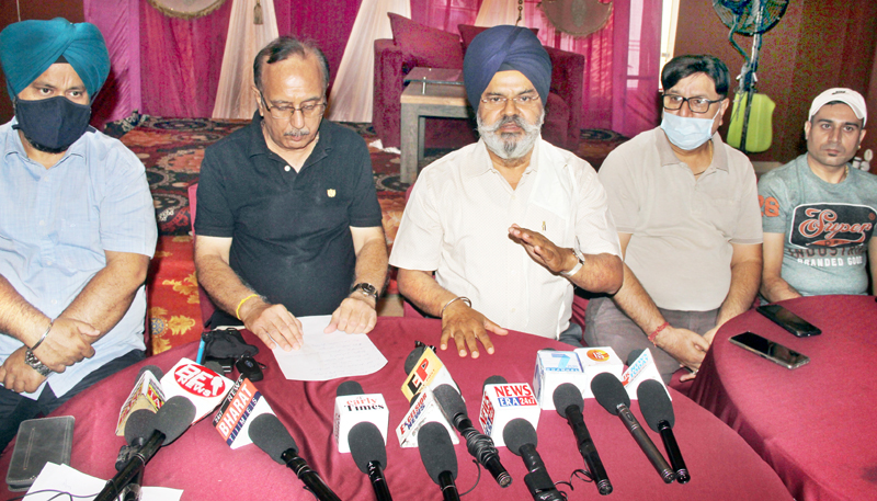 Erstwhile wine traders addressing a press conference at Jammu on Wednesday. -Excelsior/Rakesh Erstwhile wine traders addressing a press conference at Jammu on Wednesday. -Excelsior/Rakesh