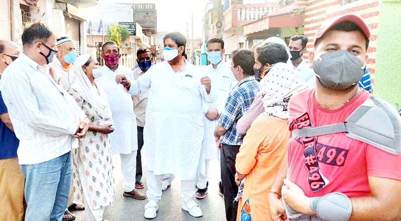 Raman Bhalla listening to grievances of people. Raman Bhalla listening to grievances of people.