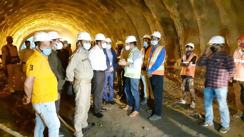 Divisional Commissioner during inspection of work on tunnel Divisional Commissioner during inspection of work on tunnel