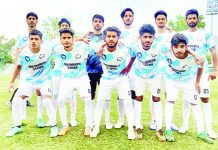 Football players posing for a group photograph during Premier UT League match at Srinagar.