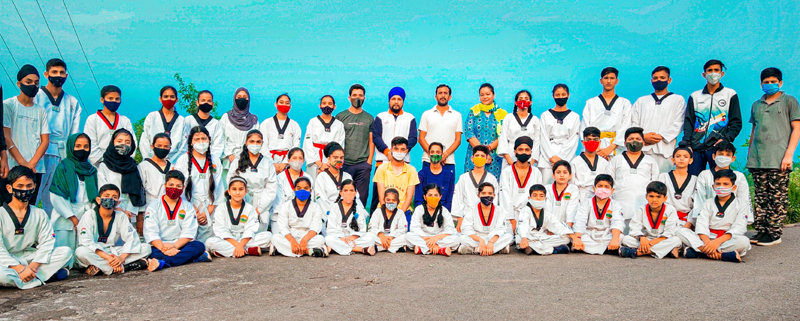 Poonch Taekwondo players posing for group photograph during expedition at Shiv Khori Poonch on Sunday.