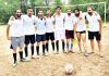 Zyeshta Devi FC players posing for a photograph after emerging victorious in Football final at Jagti in Jammu.