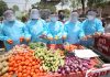 Unemployed dental surgeons selling vegetables as a mark of protest in Jammu. —Excelsior/Rakesh