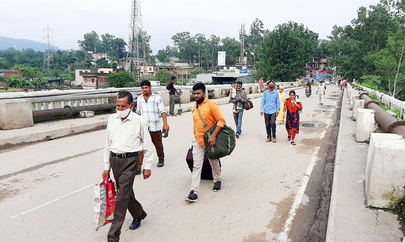 Locals crossing Birma bridge on foot to reach destinations. -Excelsior/K Kumar Locals crossing Birma bridge on foot to reach destinations. -Excelsior/K Kumar