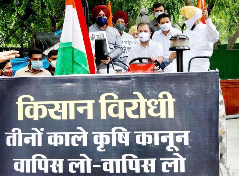 Congress leader Rahul Gandhi reaching at Vijay Chowk on a tractor in protest against the Farm Laws in New Delhi on Monday. (UNI) Congress leader Rahul Gandhi reaching at Vijay Chowk on a tractor in protest against the Farm Laws in New Delhi on Monday. (UNI)