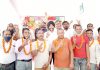 Apni Party activists posing for a photograph with provincial president Manjit Singh on Sunday.