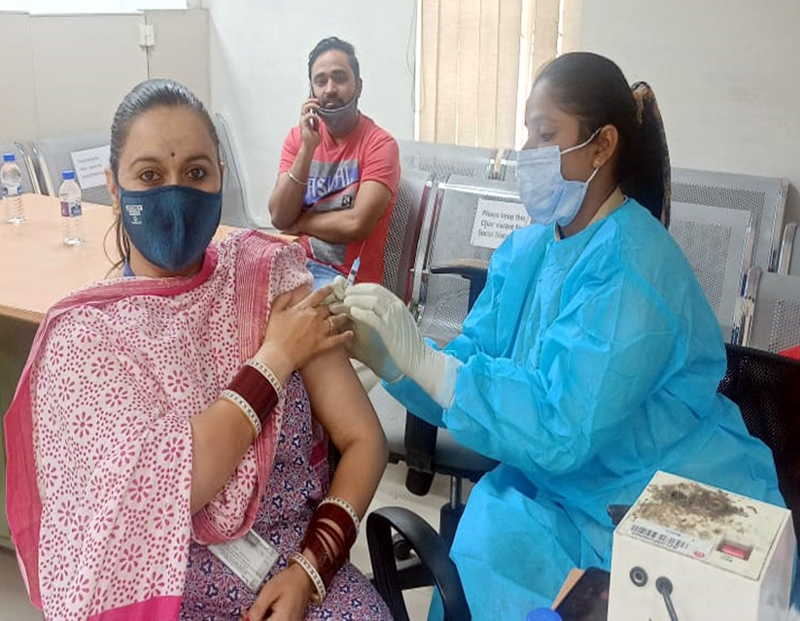A woman getting vaccine dose during a camp at Passport Seva Kendra Jammu on Saturday. A woman getting vaccine dose during a camp at Passport Seva Kendra Jammu on Saturday.