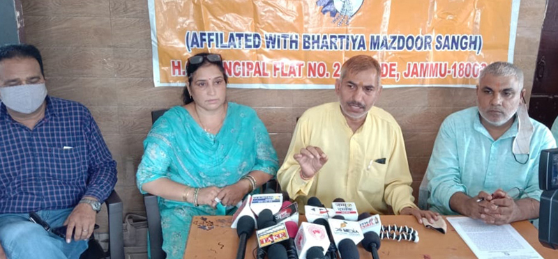 Dharmarth Trust employees addressing a press conference at Jammu on Thursday. Dharmarth Trust employees addressing a press conference at Jammu on Thursday.
