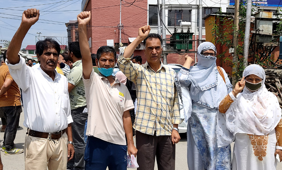 Workers of a private security firm protesting in Srinagar on Monday. —Excelsior/Shakeel Workers of a private security firm protesting in Srinagar on Monday. —Excelsior/Shakeel