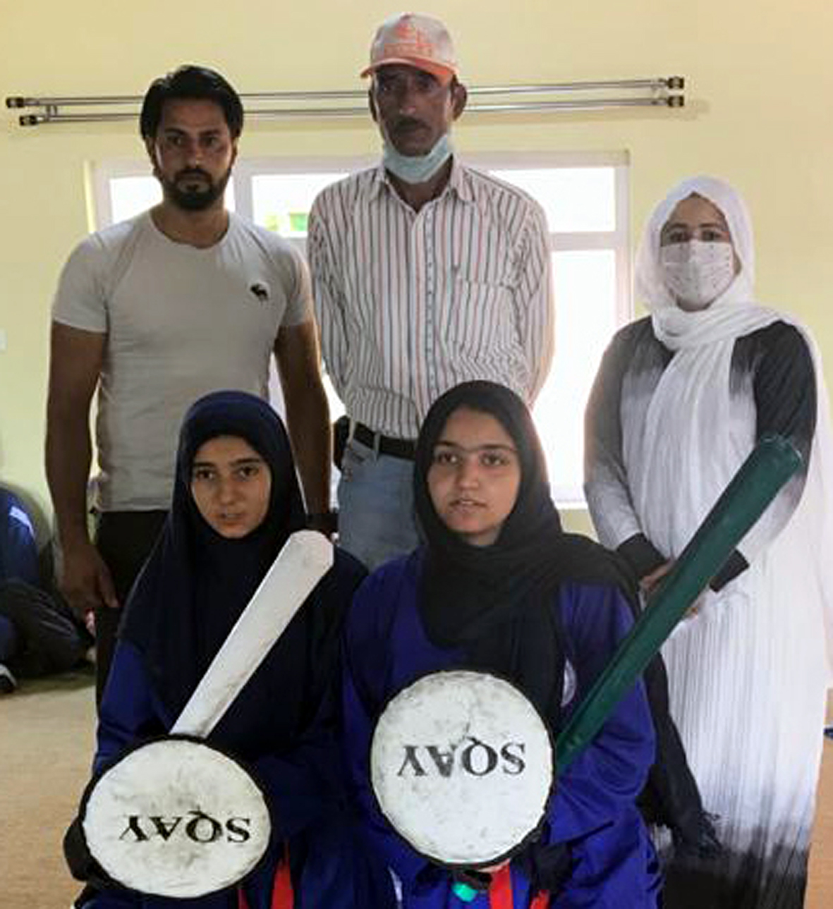 Selected Sqay players posing for a photograph with dignitaries at Pampore. Selected Sqay players posing for a photograph with dignitaries at Pampore.