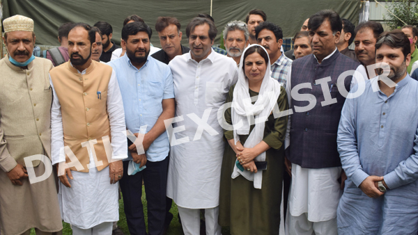 PC chief Sajjad Lone with new entrants to party in Srinagar on Saturday. —Excelsior/Shakeel