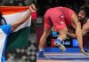 Neeraj Chopra holds tricolor after winning gold and Bajrang Punia in action before clinching bronze in Tokyo Olympics on Saturday. (UNI).