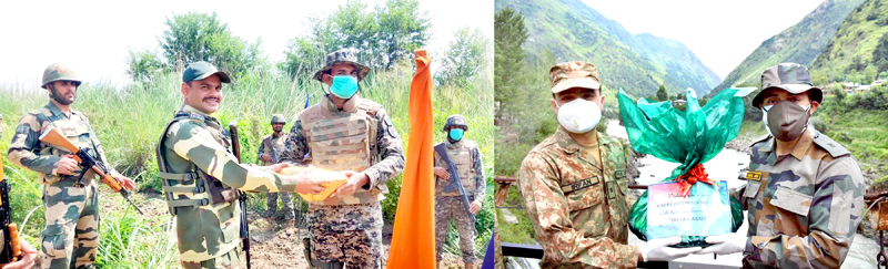 BSF and Rangers (left) and Indo-Pak Armies (right) exchange sweets in Jammu and Kashmir on Saturday. BSF and Rangers (left) and Indo-Pak Armies (right) exchange sweets in Jammu and Kashmir on Saturday.