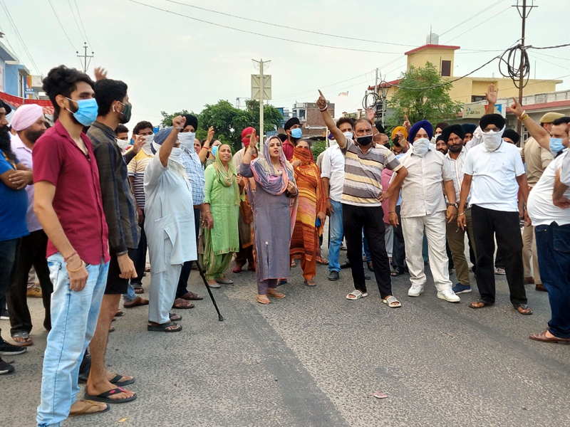 People blocking R S Pura road in protest against frequent power cuts. People blocking R S Pura road in protest against frequent power cuts.