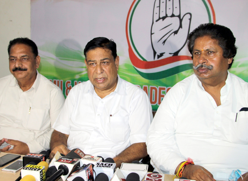 PCC chief spokesperson, Ravinder Sharma, flanked by former minister Raman Bhalla and party general secy, Manmohan Singh addressing press conference in Jammu on Friday. -Excelsior/Rakesh PCC chief spokesperson, Ravinder Sharma, flanked by former minister Raman Bhalla and party general secy, Manmohan Singh addressing press conference in Jammu on Friday. -Excelsior/Rakesh