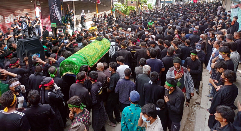 Mourners taking out Ashura procession in Kargil Town on Friday. -Excelsior/Basharat Ladakhi Mourners taking out Ashura procession in Kargil Town on Friday. -Excelsior/Basharat Ladakhi