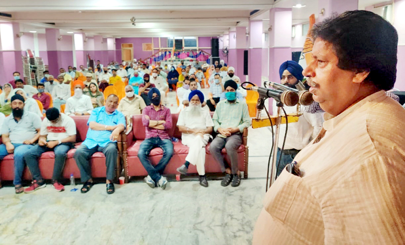 Senior Cong leader Raman Bhalla addressing workers meeting at Gangyal in Jammu on Sunday.